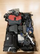 Assorted vintage and modern cameras and video cameras including Praktica, Fujifilm, Sony, Olympus,