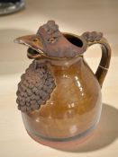 A pottery harvest jug in the form of a chicken, height 22 cm.