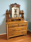 An Art Nouveau walnut dressing chest, 106 cm x 48 cm x 166 cm.