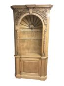 A carved pine corner display cabinet,