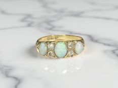 An antique 18ct gold opal and diamond ring, size P CONDITION REPORT: 3.