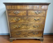 A George III mahogany and satinwood inlaid straight front five drawer bracket chest,