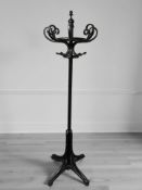 An ebonised bentwood hat and coat stand, height 208 cm.