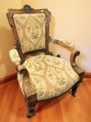 A Victorian carved walnut armchair.