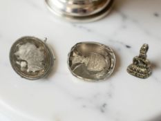 A silver seal with crystal portrait intaglio, a further intaglio with crest,