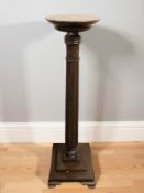 A turned mahogany column plant stand, height 116 cm.