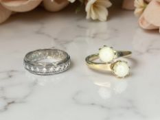 A 9ct gold and silver band ring, and a gold-plated ring.