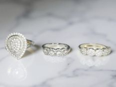 Three silver dress rings