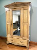 A late Victorian ash mirrored door wardrobe, 136 cm x 59 cm x 213 cm.