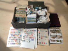 A quantity of cigarette card albums, further loose cards, colour postcards, stamp albums, etc.