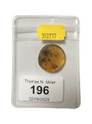 A fossilised amber specimen, diameter 2.5 cm.