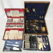 A group of cutlery canteens.