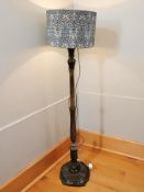A turned beech standard lamp with contemporary William Morris shade, 176 cm high.