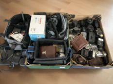A collection of vintage and later cameras including Canon AE1, Fujica ST605N, Chinon CP-7M,
