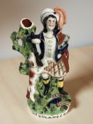 A Victorian Staffordshire figure of a highlander, height 32 cm.