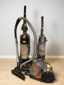 Three Vax vacuum cleaners.