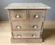 A painted pine miniature four drawer chest,