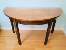 A George III mahogany demi lune table, 124 cm x 62 cm x 71 cm.