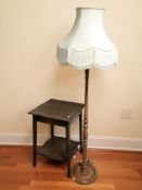 An Edwardian oak two tier occasional table and a contemporary standard lamp.