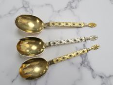 Three Norwegian J Tostrup silver gilt and yellow/white enamel salad servers