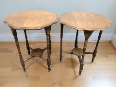 A pair of late Victorian mahogany scalloped edge two tier occasional tables, height 71 cm.