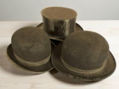 A top hat and two bowler hats.
