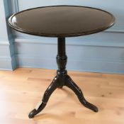 A George III and later mahogany tilt top tripod occasional table, diameter 67 cm.