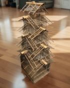 A large decorative wooden bird cage,