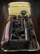 A Bush radio, together with a Zenit E camera body, various lenses, Polaroid camera, tripod, etc.