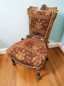 A Victorian carved walnut lady's chair.