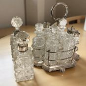 A pair of silver collared crystal perfume bottles and an EPNS cruet set.