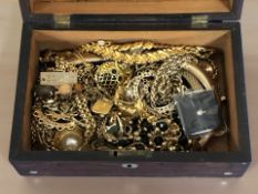 A Victorian rosewood jewellery box containing assorted gold plated costume jewellery,
