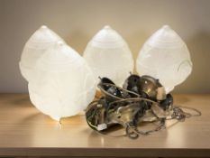A group of four 20th century pendant light fittings, with frosted pressed glass shades.