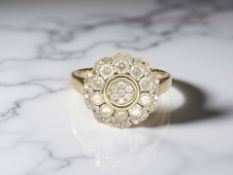 A 9ct gold diamond cluster ring, set with 47 stones, total weight approximately 1.