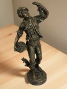 A spelter figure of a boy harvesting fruit, height 44 cm.