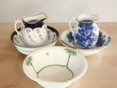 A Crescent Pottery wash jug and basin, a further Saskia blue and white jug and basin,