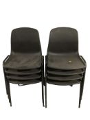 A set of eight moulded plastic stackable chairs.