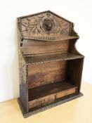 A Victorian carved oak shelf,