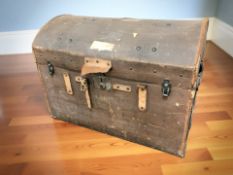 An early 20th century canvas domed topped trunk,