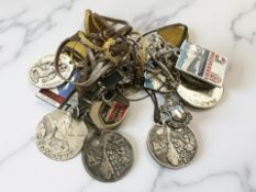A collection of vintage badges / medallions from various ski resorts including Zermatt