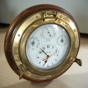 A reproduction quartz ship's timepiece, with barometer, hygrometer and thermometer,