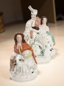 Two Victorian Staffordshire figure groups, tallest 37 cm.