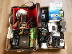 A collection of vintage and modern cameras including Pentax, Panasonic, Sony, Canon,