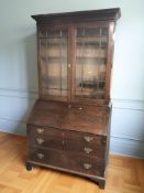 A George III oak bureau bookcase, 123 cm x 60 cm x 223 cm.
