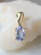 A 10ct gold tanzanite pendant, 0.73 carat, length 14mm.