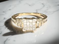 A 9ct gold diamond cluster ring, size R CONDITION REPORT: 2.
