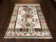 A geometric Kilim rug, 243 cm x 167 cm.