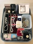 A collection of costume jewellery including dress rings, a white metal and moonstone bracelet,