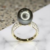 A 14ct gold diamond and Tahitian pearl ring, the total diamond weight 0.61ct, size L.