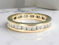 An 18ct gold full eternity ring set with round and princess cut diamonds, approximately 1ct,